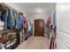 Large walk-in closet has organization for clothing, shoes, and a wardrobe at 5181 Appleton Way, Castle Rock, CO 80104