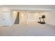 Finished basement featuring a staircase, treadmill and an open area, perfect for a home gym at 8137 Ralston Creek Ave, Littleton, CO 80125