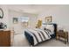 Cozy bedroom with a blue bed, neutral walls, and carpet at 8137 Ralston Creek Ave, Littleton, CO 80125