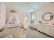 Charming pink bedroom featuring a princess-style canopy bed, dresser, and decorative mirror at 8137 Ralston Creek Ave, Littleton, CO 80125