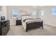 Comfortable bedroom with a cozy bed, dresser, and natural light at 8137 Ralston Creek Ave, Littleton, CO 80125