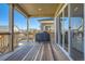 Covered wooden deck with a grill, perfect for outdoor entertaining and relaxation at 8137 Ralston Creek Ave, Littleton, CO 80125