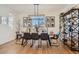 Elegant dining room featuring a large table, modern lighting, and stylish decor at 8137 Ralston Creek Ave, Littleton, CO 80125