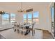 Bright dining room featuring a large windows and stylish decor at 8137 Ralston Creek Ave, Littleton, CO 80125