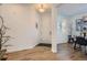 Bright foyer features hardwood floors and access to the dining area at 8137 Ralston Creek Ave, Littleton, CO 80125
