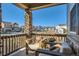 Cozy front porch features comfortable seating with a view of the neighborhood at 8137 Ralston Creek Ave, Littleton, CO 80125