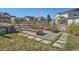 The backyard garden includes a stepping stone path and three wooden planting boxes surrounded by grass and gravel at 8137 Ralston Creek Ave, Littleton, CO 80125