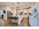 Open-concept kitchen features a large island, stainless steel appliances, and ample storage at 8137 Ralston Creek Ave, Littleton, CO 80125