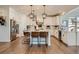Spacious open kitchen featuring an island with seating and stainless steel appliances at 8137 Ralston Creek Ave, Littleton, CO 80125
