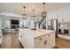 Gourmet kitchen with large center island, stainless appliances, and seamless flow to living areas at 8137 Ralston Creek Ave, Littleton, CO 80125
