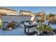 A patio features a built in fire pit, modern outdoor furniture and lovely decorative flowers and pumpkins at 8137 Ralston Creek Ave, Littleton, CO 80125