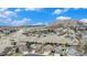 Scenic view of homes in a neighborhood with rolling hills in the background at 1479 Short Grass Ct, Castle Rock, CO 80109
