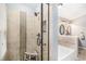 Bathroom featuring a glass-enclosed shower, soaking tub, and a stylish double vanity with modern fixtures at 1479 Short Grass Ct, Castle Rock, CO 80109