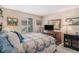 Comfortable bedroom with quilt, window view, and plenty of dresser storage at 1479 Short Grass Ct, Castle Rock, CO 80109