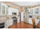 Modern kitchen with white cabinets, stainless steel appliances, and granite countertops at 1479 Short Grass Ct, Castle Rock, CO 80109