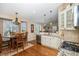 Bright kitchen features granite countertops, stainless steel appliances, and breakfast nook at 1479 Short Grass Ct, Castle Rock, CO 80109