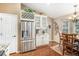 Bright kitchen and dining area features stainless steel appliances, granite counters, and a charming breakfast nook at 1479 Short Grass Ct, Castle Rock, CO 80109