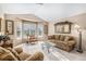 Inviting living room with bay window, comfortable seating, and neutral decor at 1479 Short Grass Ct, Castle Rock, CO 80109