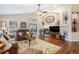 Inviting living room with a fireplace, hardwood floors, and sliding glass doors at 1479 Short Grass Ct, Castle Rock, CO 80109