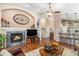 Stylish living room featuring a fireplace, built-in shelving, and hardwood floors at 1479 Short Grass Ct, Castle Rock, CO 80109