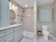 Bright bathroom features single sink, light grey cabinets and a shower at 5336 High Rd, Evergreen, CO 80439