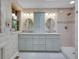Bathroom with double sink vanity, shower and tile floors at 5336 High Rd, Evergreen, CO 80439