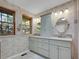 Bathroom featuring a double sink vanity, shower and updated fixtures at 5336 High Rd, Evergreen, CO 80439