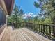 A spacious wooden deck offers forest views at 5336 High Rd, Evergreen, CO 80439