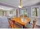 Dining room featuring a wood table with upholstered chairs and lots of natural light at 5336 High Rd, Evergreen, CO 80439
