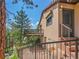 Lovely home featuring stairways, a balcony, and forest views at 5336 High Rd, Evergreen, CO 80439