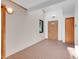Hallway features tile flooring, neutral walls, and wooden doors at 5336 High Rd, Evergreen, CO 80439