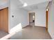 Hallway with neutral walls, tile flooring and natural lighting at 5336 High Rd, Evergreen, CO 80439
