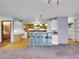 Spacious kitchen with breakfast bar, pendant lighting, and open floor plan at 5336 High Rd, Evergreen, CO 80439