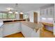 Bright kitchen with breakfast bar with tile accents and wooden cabinets at 5336 High Rd, Evergreen, CO 80439
