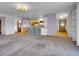 Open-concept living space features hardwood floors, bar seating, and a large living room at 5336 High Rd, Evergreen, CO 80439