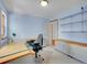 Bright office with storage cabinets, built-in desk, and ample natural light at 5336 High Rd, Evergreen, CO 80439
