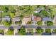 An aerial shot shows the rooftops and mature trees of a suburban neighborhood, and a view of cars parked on the street at 10563 Pierson Cir, Broomfield, CO 80021