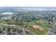 Aerial view of a suburban neighborhood, outdoor pool, lakes, parks, and baseball fields at 10563 Pierson Cir, Broomfield, CO 80021