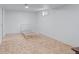 Finished basement space with parquet flooring, white walls, and a window for natural light at 10563 Pierson Cir, Broomfield, CO 80021
