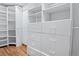 Walk-in closet featuring custom shelving and drawers for ample storage space at 10563 Pierson Cir, Broomfield, CO 80021
