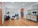 Bright living room featuring hardwood floors, neutral decor, and modern furnishings at 10563 Pierson Cir, Broomfield, CO 80021