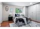 Cozy main bedroom featuring wood floors, natural light and a large closet for ample storage at 10563 Pierson Cir, Broomfield, CO 80021