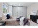 Comfortable main bedroom featuring a large window, hardwood floors, and a neutral color scheme at 10563 Pierson Cir, Broomfield, CO 80021