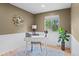 Bright office featuring neutral walls, white wainscoting, and a large window for natural light at 10563 Pierson Cir, Broomfield, CO 80021