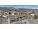 Scenic aerial view of the condo community surrounded by trees and mountains in the distance at 12093 W Cross Dr # 304, Littleton, CO 80127