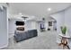 Finished basement Gathering room with fireplace and entertainment center at 6610 S Waco Way, Aurora, CO 80016