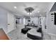 Finished basement Gathering room with sectional sofa and ottoman at 6610 S Waco Way, Aurora, CO 80016