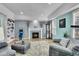 Living room with fireplace, hardwood floors, and built-ins at 6610 S Waco Way, Aurora, CO 80016