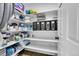 Well-organized storage room with shelving for linens and supplies at 6610 S Waco Way, Aurora, CO 80016