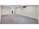 Spacious basement area with carpeted floors and a large doorway leading to another room at 770 Locust, Denver, CO 80220